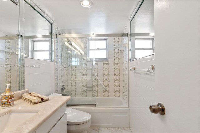 2101 S Ocean Dr Unit 2707, Hollywood, FL 33019 - bathroom with vanity, shower / bath combination with glass door, marble finish floors, and tile walls