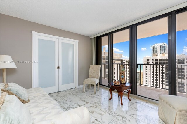 2101 S Ocean Dr Unit 2707, Hollywood, FL 33019 - bedroom with french doors, access to exterior, marble finish flooring, a city view, and a closet