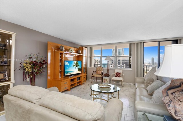 2101 S Ocean Dr Unit 2707, Hollywood, FL 33019 - living area featuring marble tiled flooring and healthy amount of natural light