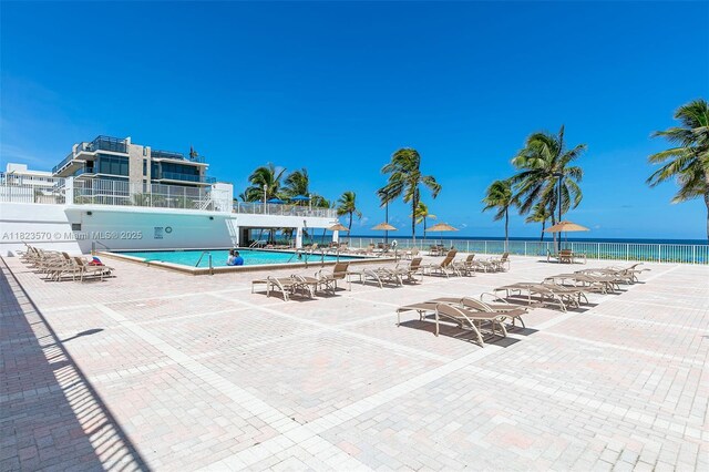 2101 S Ocean Dr Unit 2707, Hollywood, FL 33019 - community pool featuring a patio area and a water view