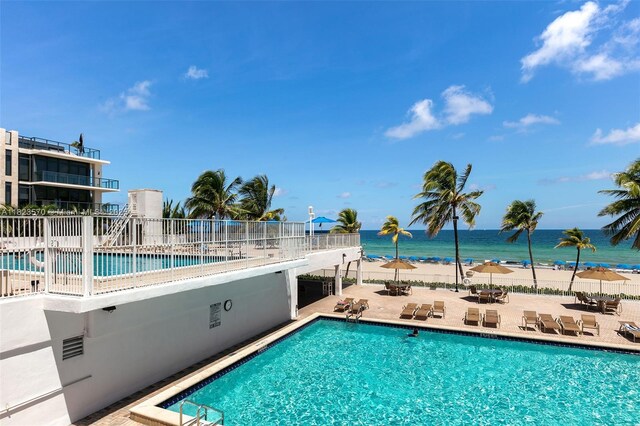 2101 S Ocean Dr Unit 2707, Hollywood, FL 33019 - community pool featuring a patio area and a water view