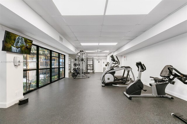 2101 S Ocean Dr Unit 2707, Hollywood, FL 33019 - exercise room with a paneled ceiling and baseboards