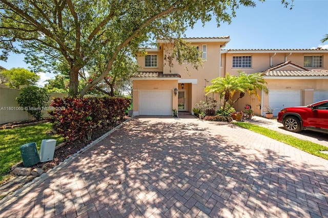 3869 NW 92nd Ave, Sunrise, FL 33351 - view of front facade with decorative driveway, stucco siding, a garage, and a tile roof