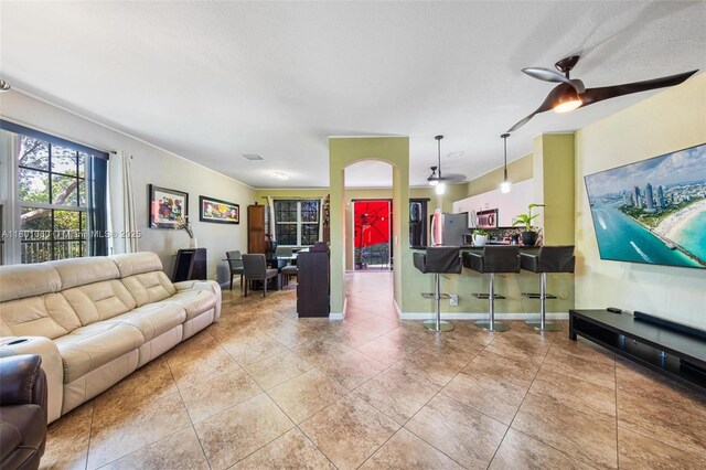 3869 NW 92nd Ave, Sunrise, FL 33351 - living room with a ceiling fan and tile patterned flooring