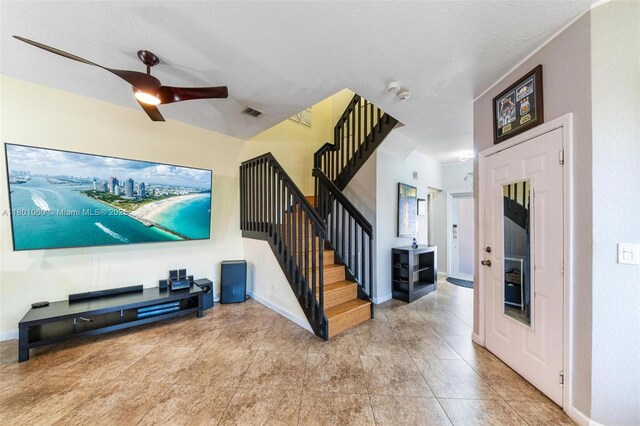 3869 NW 92nd Ave, Sunrise, FL 33351 - tiled home theater room with ceiling fan and baseboards