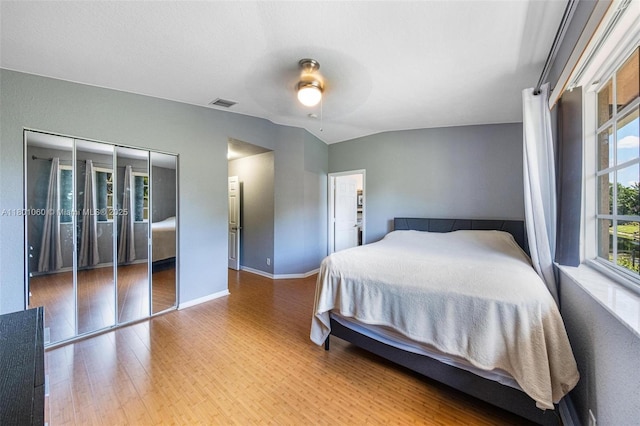3869 NW 92nd Ave, Sunrise, FL 33351 - bedroom featuring wood finished floors, ceiling fan, and vaulted ceiling