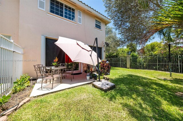 3869 NW 92nd Ave, Sunrise, FL 33351 - fenced backyard with a patio area