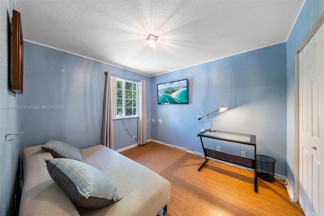3869 NW 92nd Ave, Sunrise, FL 33351 - sitting room featuring wood finished floors and a textured ceiling
