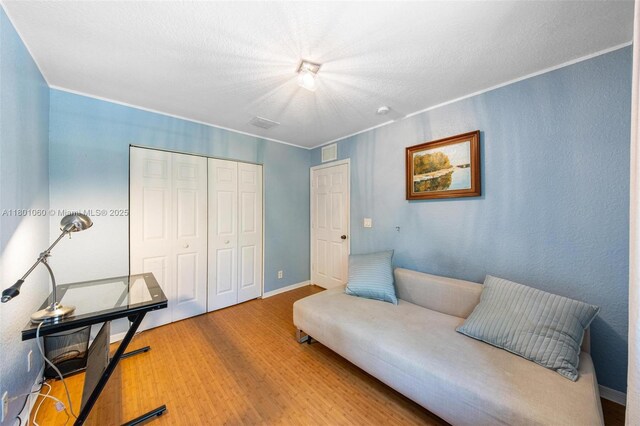 3869 NW 92nd Ave, Sunrise, FL 33351 - office area featuring wood finished floors and a textured ceiling