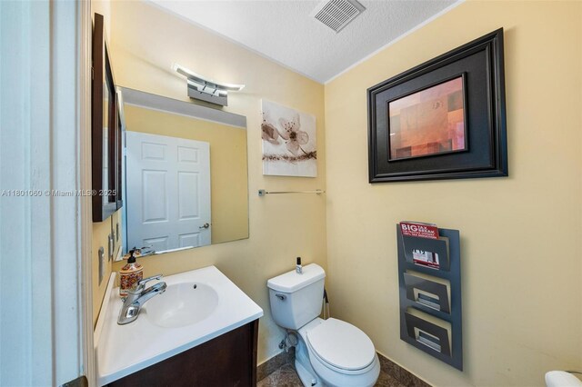 3869 NW 92nd Ave, Sunrise, FL 33351 - bathroom featuring vanity and a textured ceiling