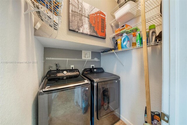 3869 NW 92nd Ave, Sunrise, FL 33351 - washroom with washing machine and dryer and a textured wall