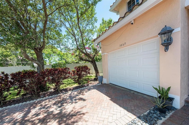 3869 NW 92nd Ave, Sunrise, FL 33351 - garage featuring decorative driveway