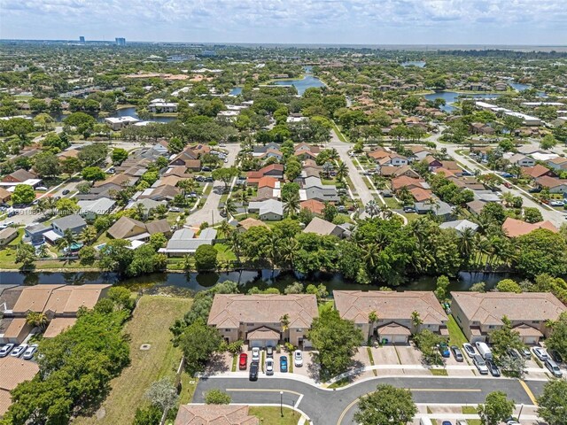 3869 NW 92nd Ave, Sunrise, FL 33351 - aerial overview of property's location featuring nearby suburban area and a large body of water