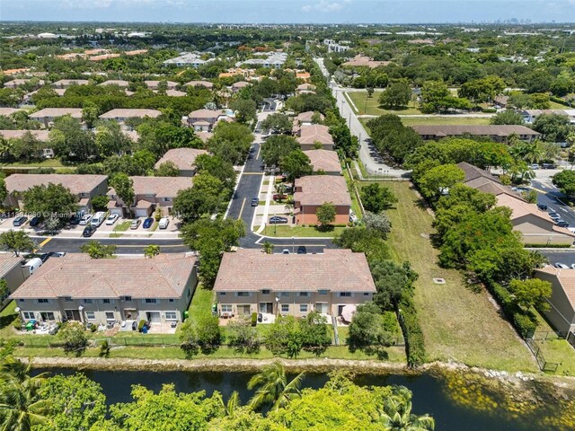 3869 NW 92nd Ave, Sunrise, FL 33351 - aerial view of property and surrounding area with a large body of water and nearby suburban area