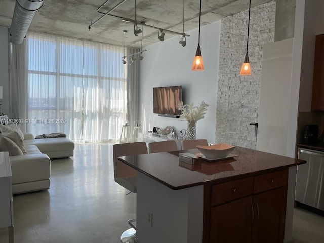 2001 Biscayne Blvd Unit 3608, Miami, FL 33137 - kitchen with stainless steel dishwasher, open floor plan, a center island, dark countertops, and concrete flooring