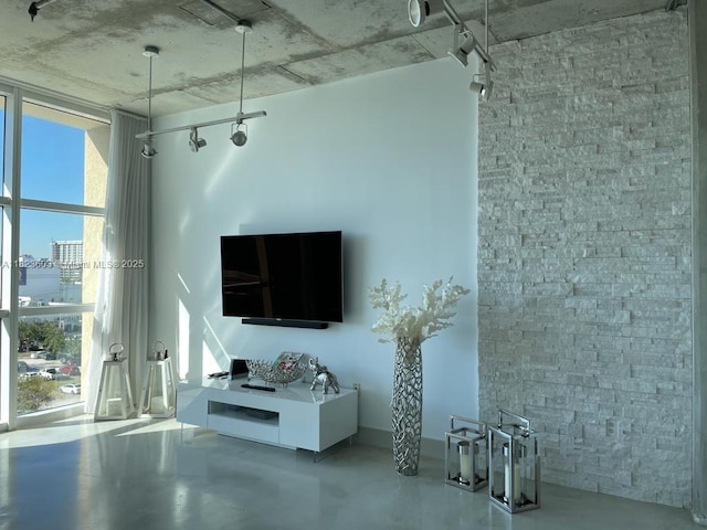 2001 Biscayne Blvd Unit 3608, Miami, FL 33137 - living room with concrete flooring and rail lighting