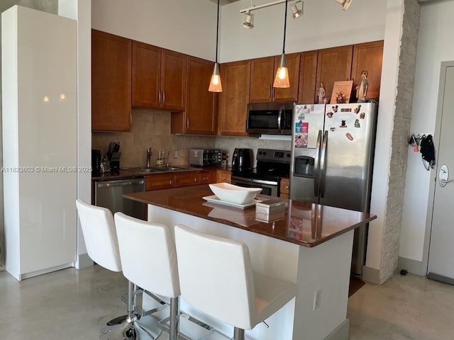 2001 Biscayne Blvd Unit 3608, Miami, FL 33137 - kitchen featuring stainless steel appliances, dark countertops, decorative backsplash, and finished concrete flooring