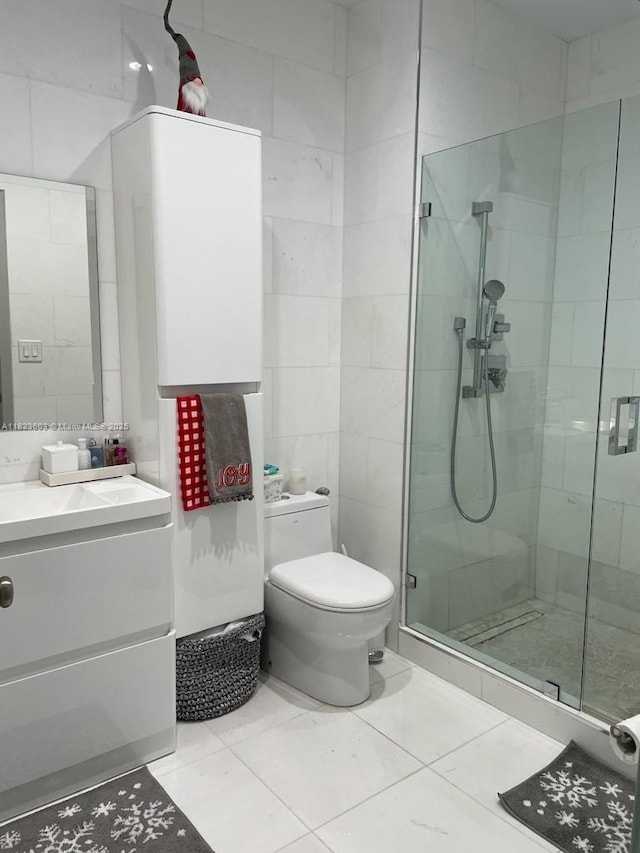 2001 Biscayne Blvd Unit 3608, Miami, FL 33137 - bathroom featuring a stall shower, tile patterned floors, vanity, and tile walls