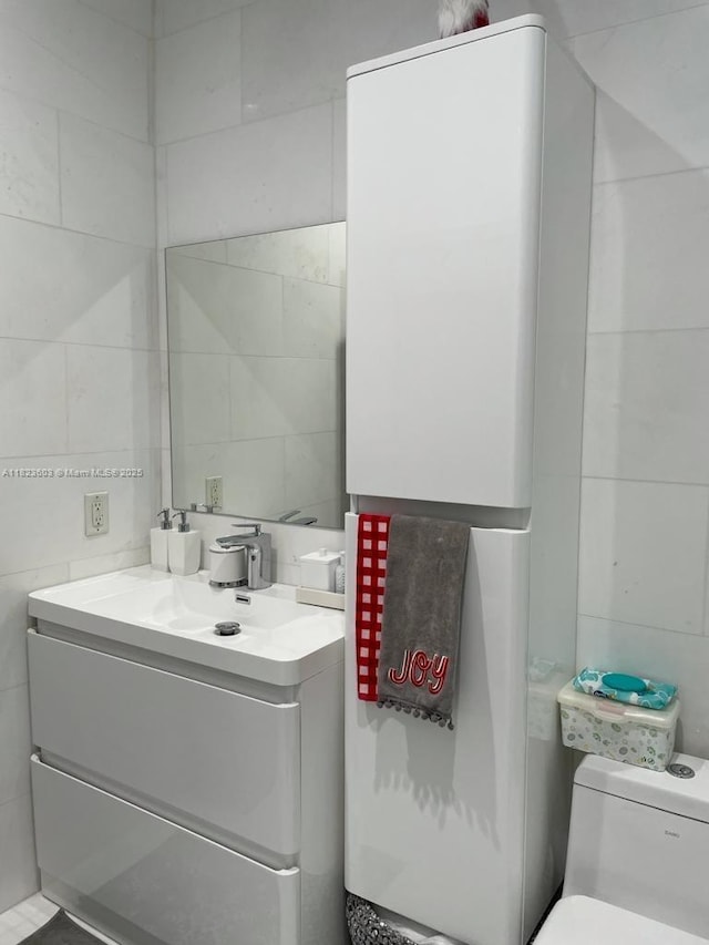 2001 Biscayne Blvd Unit 3608, Miami, FL 33137 - bathroom featuring tile walls and vanity