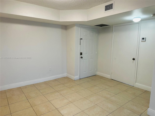 15221 SW 80th St Unit 304, Miami, FL 33193 - empty room with light tile patterned flooring and a textured ceiling