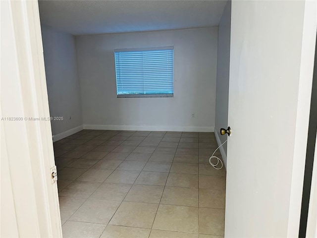 15221 SW 80th St Unit 304, Miami, FL 33193 - unfurnished room featuring light tile patterned floors and baseboards