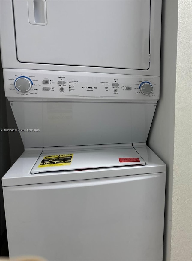 15221 SW 80th St Unit 304, Miami, FL 33193 - laundry area featuring stacked washer / drying machine