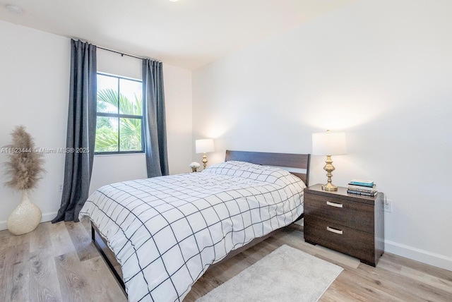 11456 SW 254th St, Homestead, FL 33032 - bedroom featuring baseboards and light wood-type flooring