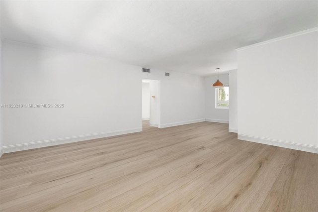 7635 SW 57th Ave Unit 2, South Miami, FL 33143 - spare room featuring light wood-type flooring and baseboards