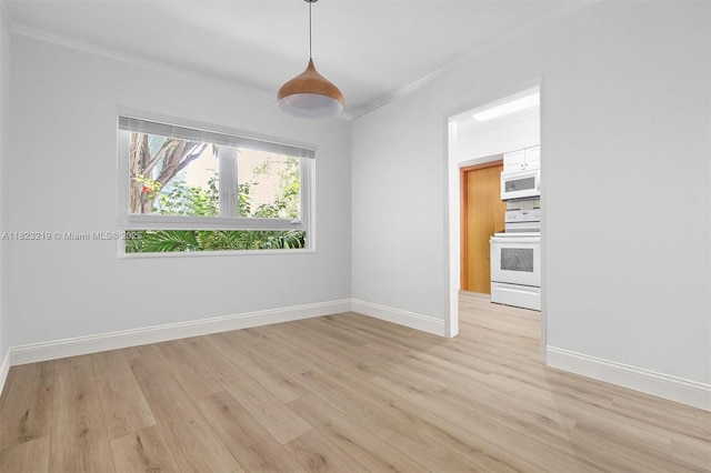 7635 SW 57th Ave Unit 2, South Miami, FL 33143 - spare room with ornamental molding and light wood-style flooring