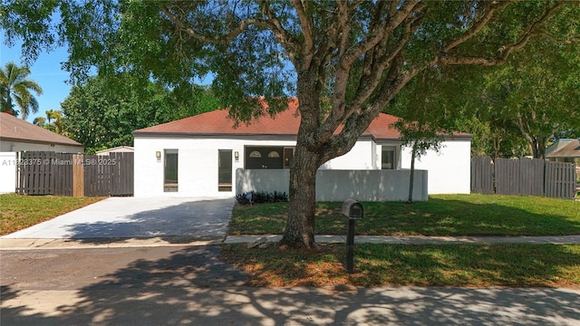 4996 SW 95th Ave, Cooper City, FL 33328 - view of front of house with driveway and stucco siding