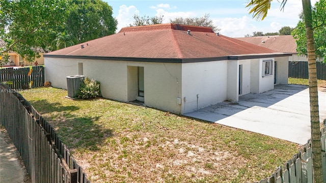 4996 SW 95th Ave, Cooper City, FL 33328 - rear view of property with a fenced backyard, roof with shingles, a patio, and stucco siding
