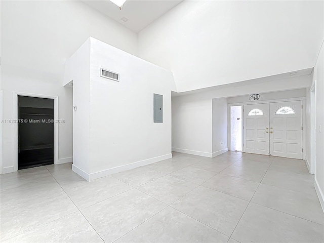 4996 SW 95th Ave, Cooper City, FL 33328 - entryway featuring a high ceiling, electric panel, and light tile patterned floors