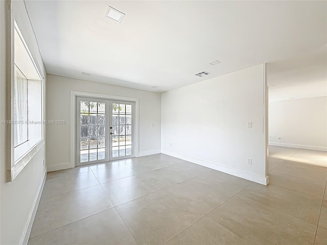 4996 SW 95th Ave, Cooper City, FL 33328 - empty room with french doors and baseboards