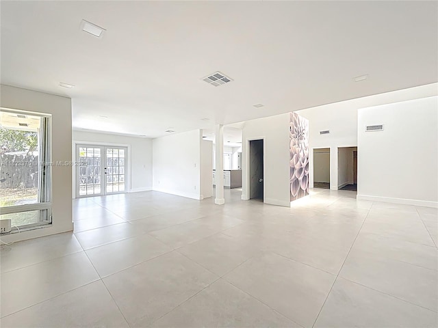 4996 SW 95th Ave, Cooper City, FL 33328 - spare room with light tile patterned floors and french doors