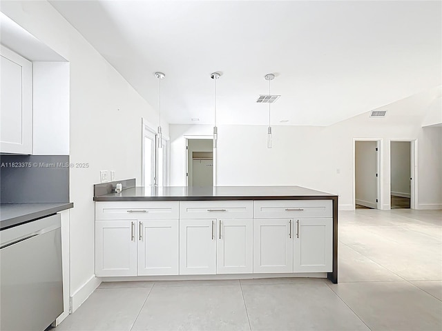 4996 SW 95th Ave, Cooper City, FL 33328 - kitchen featuring dishwasher, dark countertops, light tile patterned floors, and white cabinets