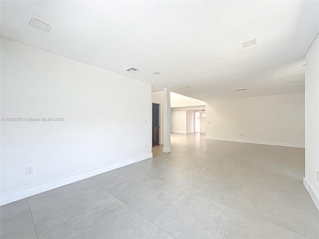 4996 SW 95th Ave, Cooper City, FL 33328 - spare room with baseboards and concrete floors