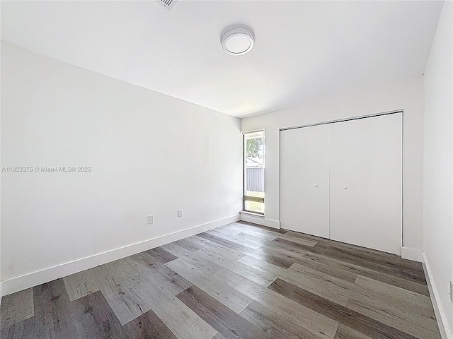 4996 SW 95th Ave, Cooper City, FL 33328 - unfurnished bedroom with wood finished floors and a closet
