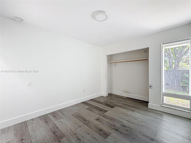 4996 SW 95th Ave, Cooper City, FL 33328 - unfurnished bedroom featuring wood finished floors and a closet