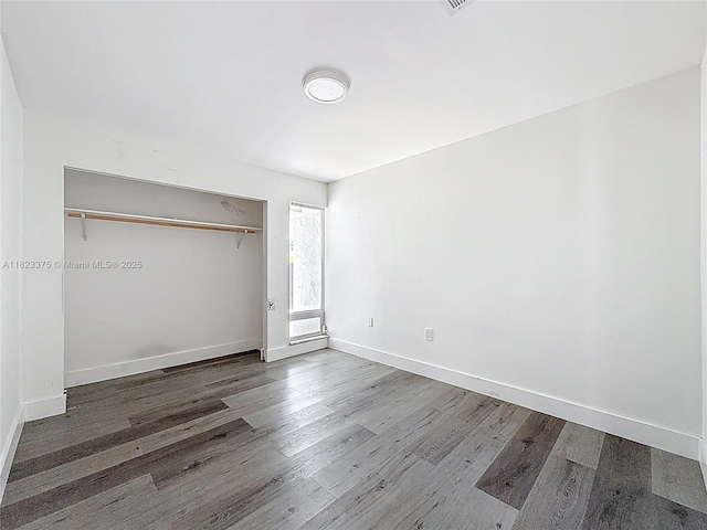 4996 SW 95th Ave, Cooper City, FL 33328 - unfurnished bedroom with wood finished floors and a closet