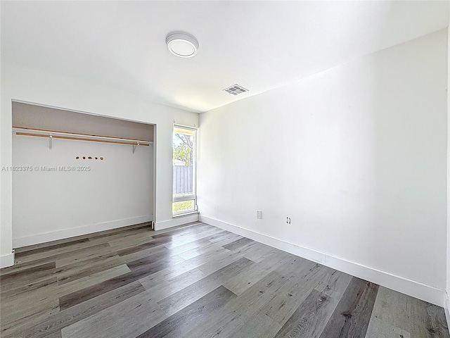 4996 SW 95th Ave, Cooper City, FL 33328 - unfurnished bedroom with wood finished floors and a closet