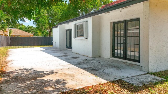 4996 SW 95th Ave, Cooper City, FL 33328 - view of patio / terrace featuring french doors