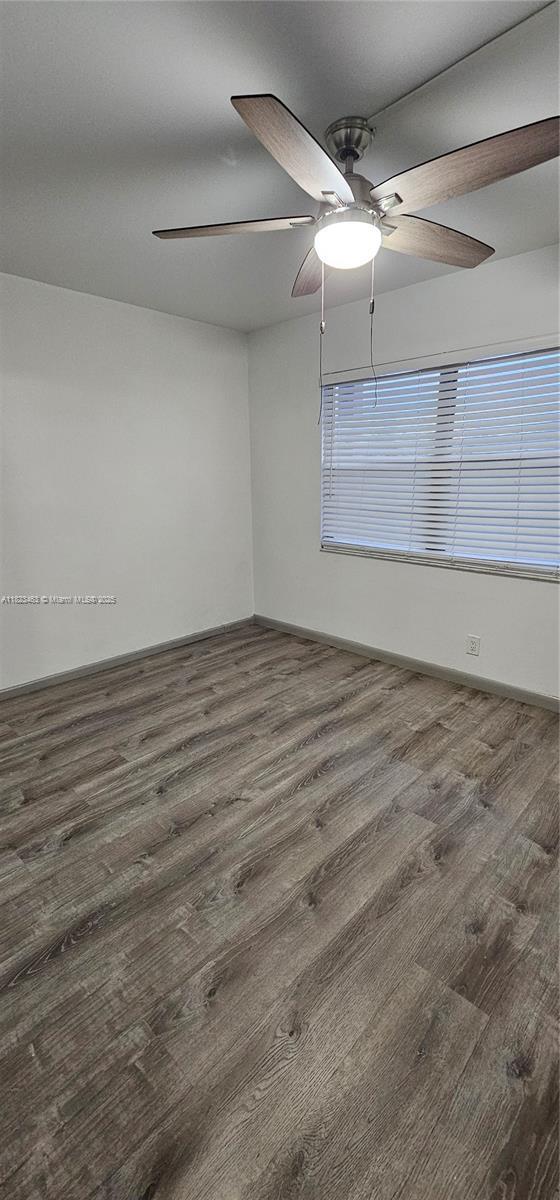 100 SW 130th Ter Unit 309C, Pembroke Pines, FL 33027 - empty room featuring wood finished floors and ceiling fan