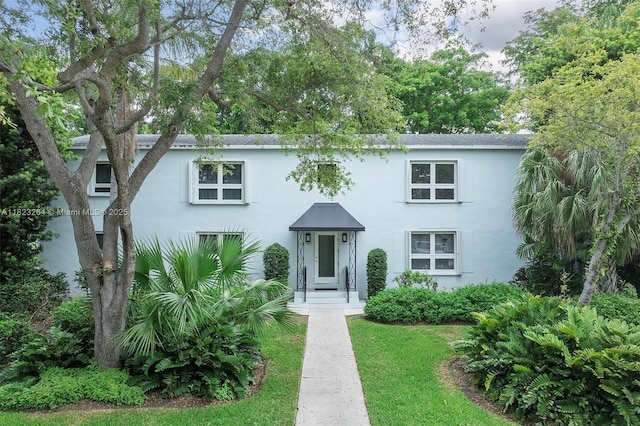 7700 SW 56th Ave Unit 2, Miami, FL 33143 - view of front of home with stucco siding and a front lawn