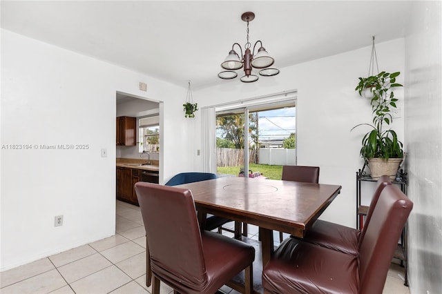 8851 NW 12th St, Pembroke Pines, FL 33024 - dining room featuring a chandelier, light tile patterned floors, and healthy amount of natural light