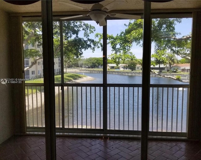 9587 Weldon Cir Unit B203, Tamarac, FL 33321 - unfurnished sunroom featuring a water view