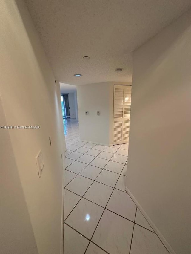 9587 Weldon Cir Unit B203, Tamarac, FL 33321 - corridor with light tile patterned floors