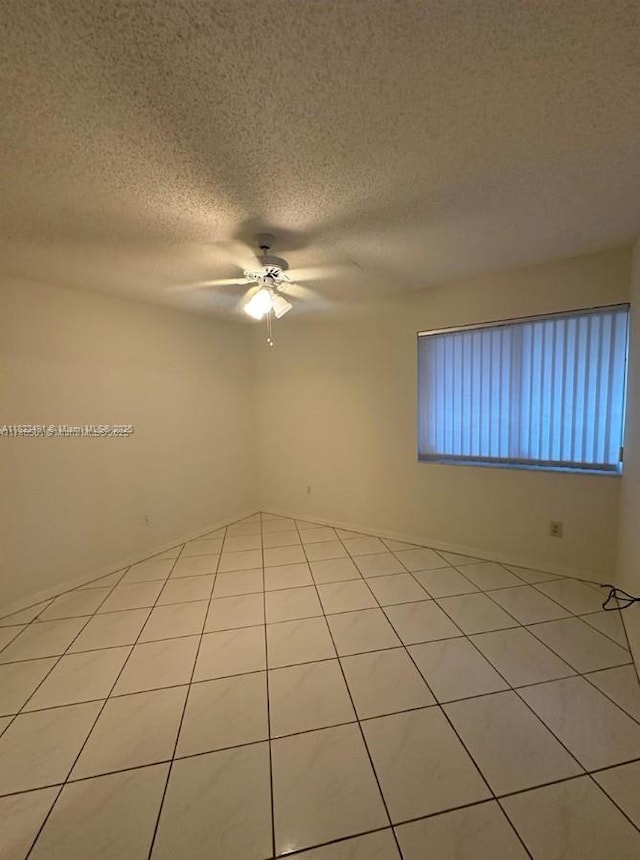 9587 Weldon Cir Unit B203, Tamarac, FL 33321 - tiled spare room with ceiling fan and a textured ceiling
