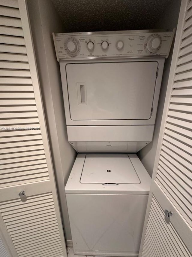 9587 Weldon Cir Unit B203, Tamarac, FL 33321 - laundry room with stacked washer and clothes dryer