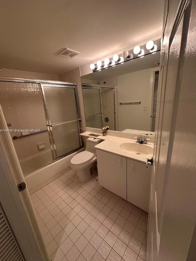 9587 Weldon Cir Unit B203, Tamarac, FL 33321 - full bath with tile patterned flooring, vanity, and bath / shower combo with glass door