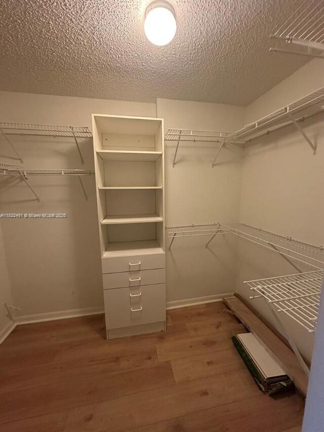 9587 Weldon Cir Unit B203, Tamarac, FL 33321 - spacious closet with wood finished floors